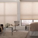 Custom light celluar shades in a bedroom