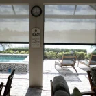 Retractable patio shades outside by the pool