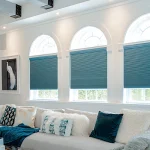 Blue cellular shades in family room of beautiful home