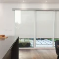 Three roller shades in kitchen of residential home