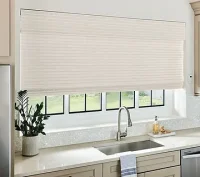 Natural woven shades in kitchen behind sink in home