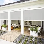 Three retractable patio shades outside beautiful home