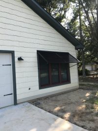 Dark exterior window shutter