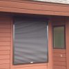 Dark metal hurricane shutters